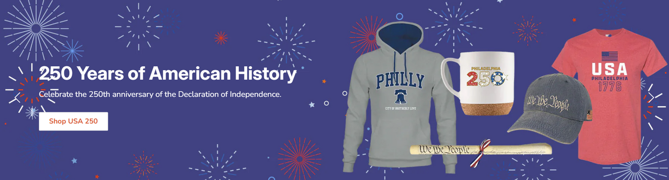 Celebrating 250 sale banner with code INDEPENDENCE250 for 15% off; features patriotic-themed Philadelphia 250 t-shirt, mug, glass, keychain, and festive stars and stripes decorations.