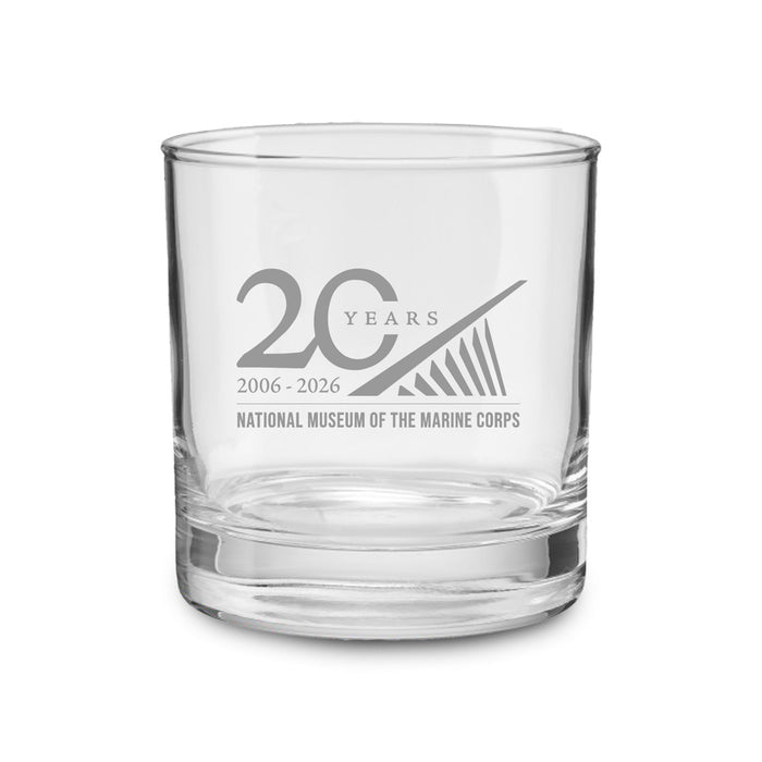 Celebrate two decades of honor and heritage with the National Museum of the Marine Corps 20th Anniversary Rocks Glass. This clear collectible glass features the museum’s 2006-2026 anniversary logo and a striking stylized design expertly etched on the front—a perfect tribute to Marine Corps history.