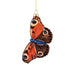 Glass Monarch Butterfly ornament with hand-painted orange, black, and blue patterned wings hanging from a gold string.