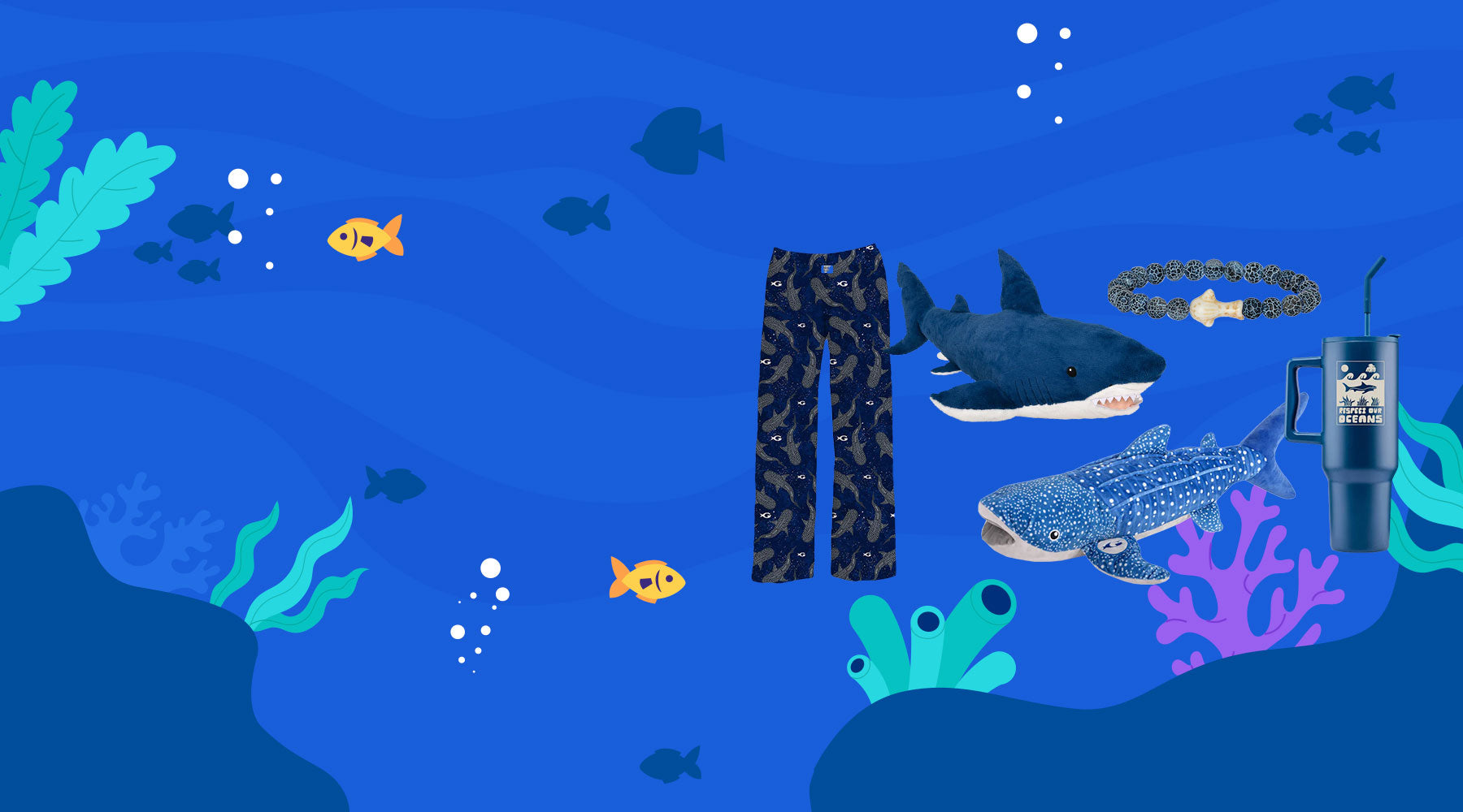 Underwater scene with cartoon fish, seaweed, and coral. In the center are shark-print pants, two plush sharks, a shark bracelet, and a blue shark-themed tumbler with a straw.