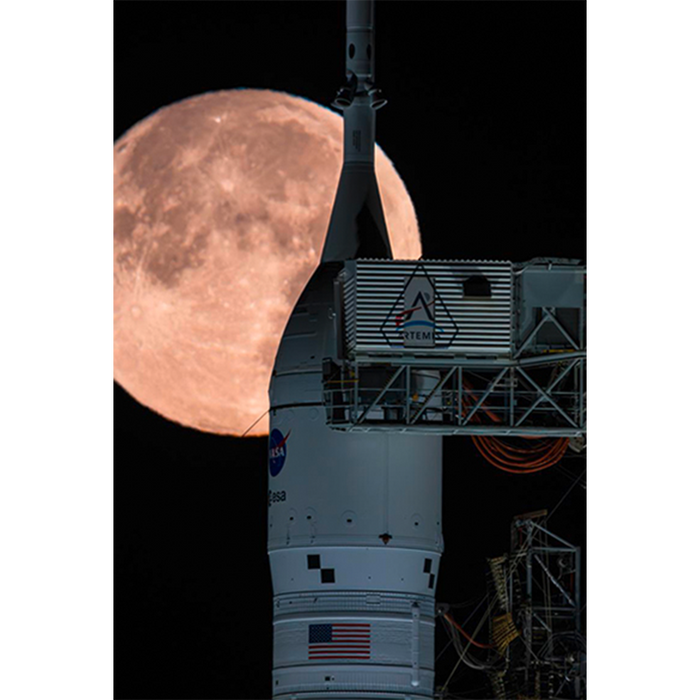 A Full Moon Lenticular magnet features a large, full moon behind a rocket on a launchpad.