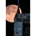 A Full Moon Lenticular magnet features a large, full moon behind a rocket on a launchpad.