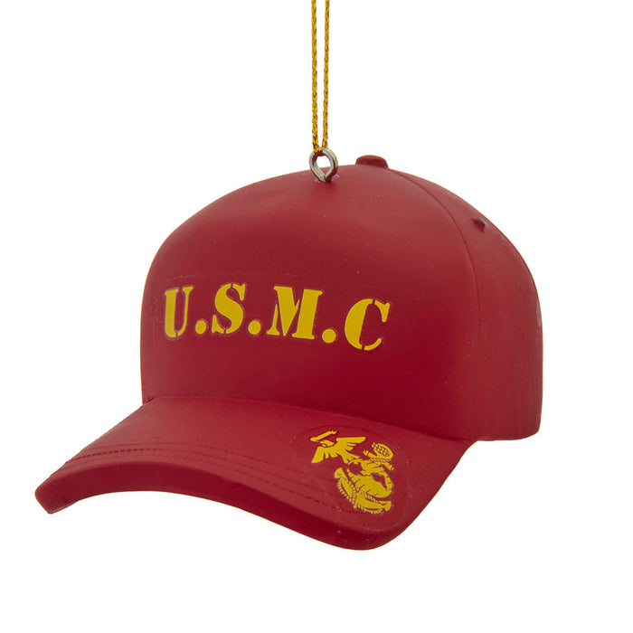 The United States Marine Corps Cap Ornament features a red baseball cap design adorned with yellow U.S.M.C. text and the official Marine Corps emblem, and hangs by a gold string—making it the perfect military Christmas ornament to honor your Marine during the holidays.