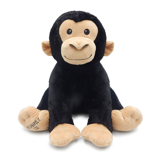 A cuddly Indianapolis Zoo Chimp Plush features soft black fur with beige accents on the face, ears, hands, and feet. Designed in a seated position with a cheerful smile, this charming plush displays "Indianapolis Zoo" printed on its left hand, making it a wonderful companion for wildlife learning or as a memorable souvenir from your trip to the zoo.