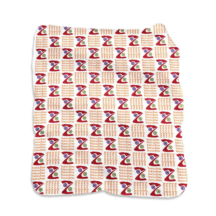 Wrap yourself in the Tulsa Zoo Raschel Blanket—featuring a rectangular design with a repeating red, green, and purple geometric pattern, stylized eyes, “TIBUSZOO” text, and red grid dots—perfect for supporting wildlife conservation.