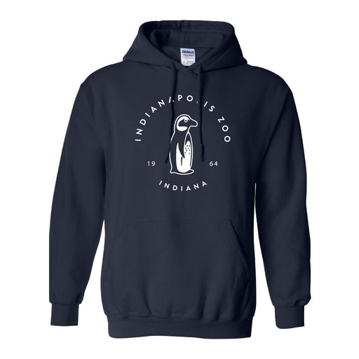 Indianapolis Zoo Simple Penguin Hooded Sweatshirt in navy blue, featuring a white circular logo with a penguin illustration and the text “INDIANAPOLIS ZOO INDIANA 1964.” This hoodie includes a front pocket and drawstrings, making it an ideal choice for supporting penguin conservation at the Indianapolis Zoo.
