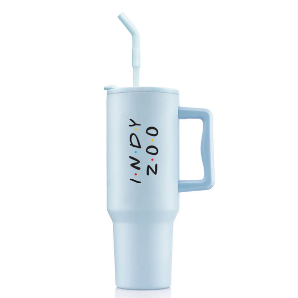 The Indianapolis Zoo Travel Tumbler is a 40 oz light blue tumbler with a handle and bent straw. INDY ZOO appears vertically in black with colorful dots. Double wall vacuum insulation keeps drinks perfectly hot or cold.