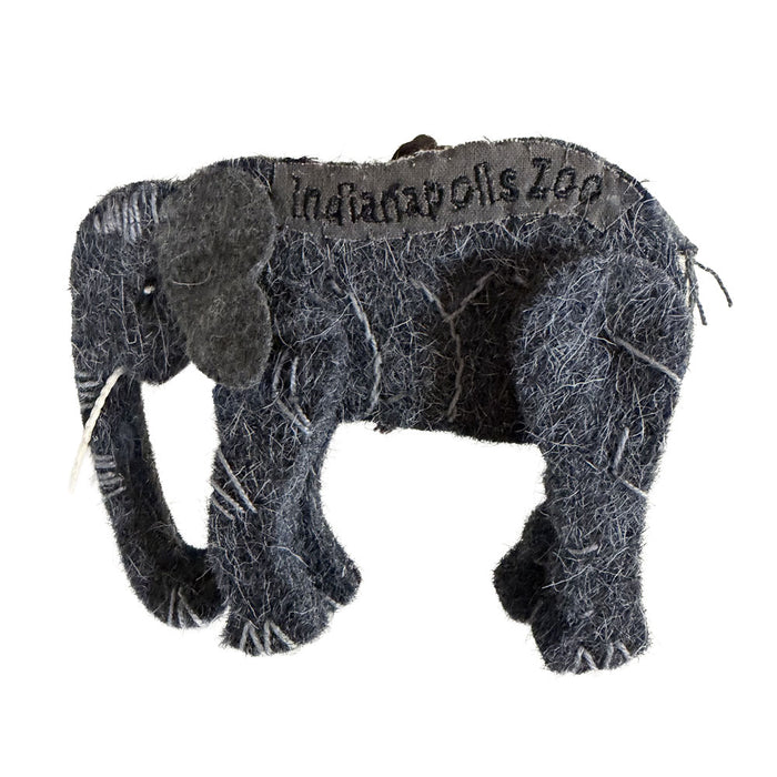 The Indianapolis Zoo Wool Elephant Ornament is a small, gray felt decoration with "Indianapolis Zoo" stitched on its back. Featuring visible white thread seams and a soft fabric texture, this charming piece celebrates the zoo’s dedication to wildlife conservation.