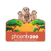 Illustration of three alert meerkats behind green trees and tall grass, with "Phoenix Zoo" and "Arizona Center for Nature Conservation" in white on orange. The Phoenix Zoo Meerkat Pop-Up Magnet is perfect for animal lovers.