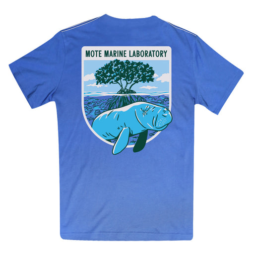 The Mote Marine Laboratory Manatee Organic T-Shirt is crafted from soft organic cotton and features a prominent back patch reading “Mote Marine Laboratory.” Its design highlights an illustrated manatee swimming by mangroves beneath a blue sky, celebrating marine conservation.