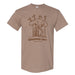 Tan t-shirt featuring a brown line drawing of giraffes gathered around a tree at a traffic light, with the text GIRAFFIC JAM and Gladys Porter Zoo below.