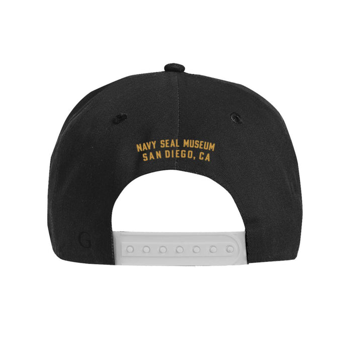 Back view of the Navy SEAL Museum Frogman Rope Cap in black, featuring yellow text that reads “Navy SEAL Museum San Diego, CA” above an adjustable white snapback closure.