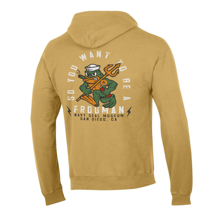 Introducing the Navy SEAL Museum Frogman Hooded Sweatshirt, showcasing a cartoon frog dressed in navy gear and holding a trident, with the slogan “So You Want to Be a Frogman.” This distinctive sweatshirt is available exclusively at the Navy SEAL Museum in San Diego, CA.