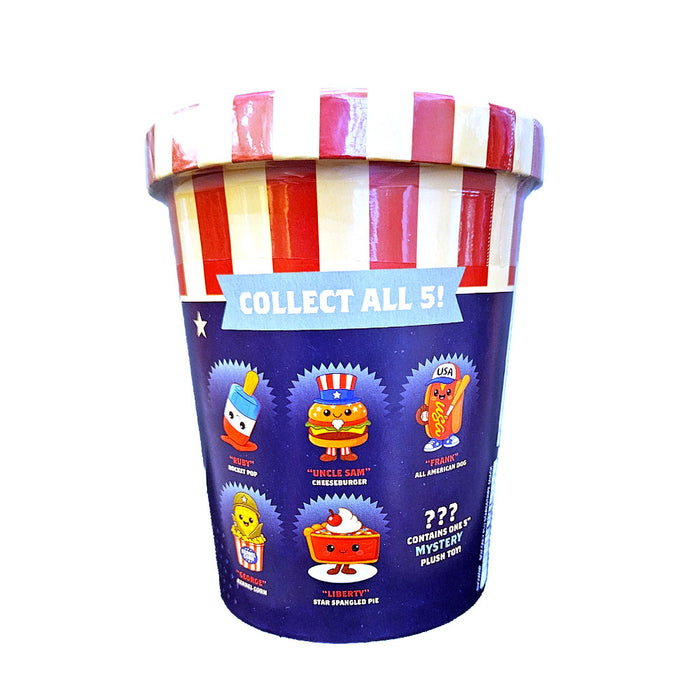 Introducing the Stars Stripes and Snacks Mystery Plush—a striped container with a label featuring cartoon food-themed toys: Uncle Sam Cheeseburger, Frankenfurter, Libertsy Star Spangled Pie, and Cornstar. Celebrate America’s 250th anniversary with these patriotic plush collectibles! Packaging reads “Collect all 5!” Each container holds one surprise plush toy.