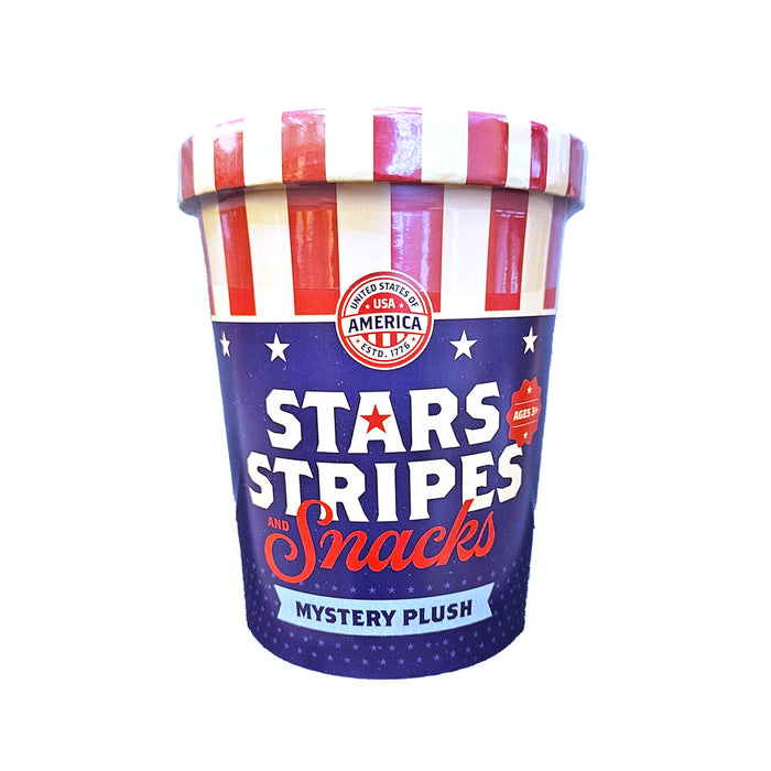 Celebrate America’s 250th anniversary with the Stars Stripes and Snacks Mystery Plush—a festive, ice cream tub-shaped container featuring a patriotic red, white, and blue design decorated with white stars. Each tub contains a surprise patriotic-themed plush inside!.