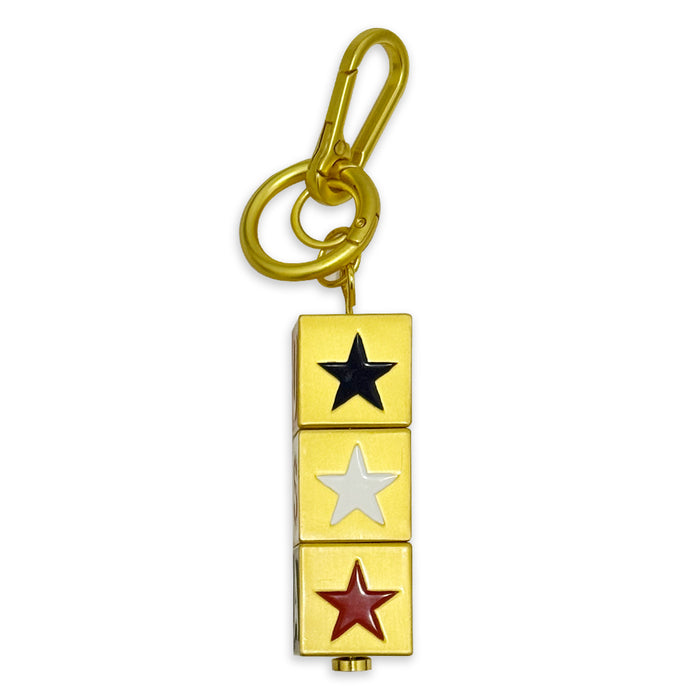 The USA Block Spinner Bag Clip features three stacked cube charms with stars—black on top, white in the middle, red on the bottom—for a patriotic and playful look.