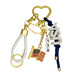 The USA Carabiner Clip is a gold heart-shaped keychain featuring USA-themed charms: a carabiner for easy attachment, braided white loop, American flag, U.S. map outline, number beads "1776," and "USA" letters on a blue cord.