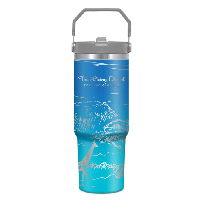 The Living Desert Zoo and Gardens Giraffe Flat Top Tumbler is a blue tumbler featuring white line drawings of mountains and a giraffe, with The Living Desert Zoo and Gardens printed on it. It comes with a gray handle and lid, making it an ideal choice for wildlife conservation enthusiasts.