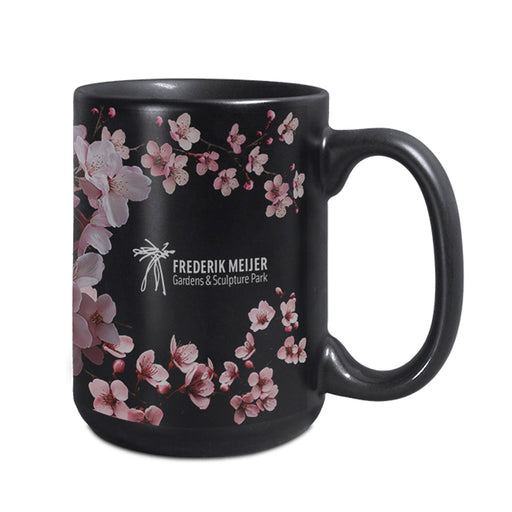 The Frederik Meijer Gardens & Sculpture Park Cherry Blossom Mug features a sleek black ceramic design adorned with delicate pink cherry blossom accents and the park’s name printed in white, making it a perfect keepsake from one of Michigan’s most beloved attractions.
