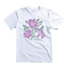 The Living Desert Zoo and Gardens Purple Hibiscus T-Shirt is a white tee showcasing a vibrant graphic of purple hibiscus flowers with green leaves and “Living Desert Zoo and Gardens” printed in green beneath the floral design—a perfect choice for supporting wildlife conservation.