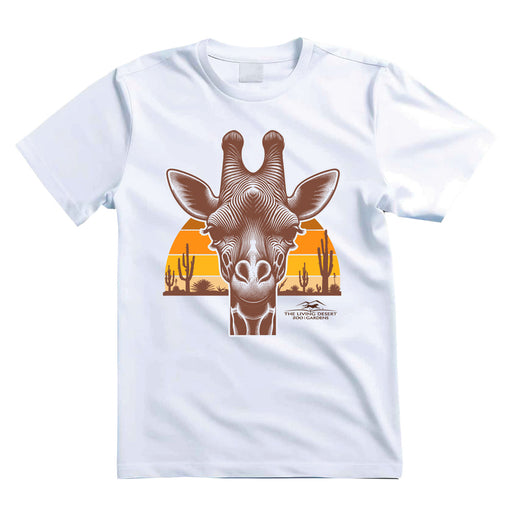 The Living Desert Zoo and Gardens Giraffe Sunset T-Shirt showcases a detailed giraffe face set against a vibrant sunset with orange and yellow tones, accented by cacti and desert plants—ideal for wildlife conservation enthusiasts and fans of The Living Desert Zoo.