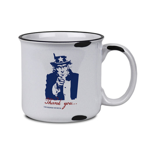The USS Midway Museum Uncle Sam Thank You Mug is a white mug with a black rim and black spots, featuring a blue illustration of Uncle Sam pointing. Below the image, the words “Thank you... USS Midway Museum” are printed in red. This patriotic mug makes an excellent keepsake to remember your visit to the USS Midway Museum.