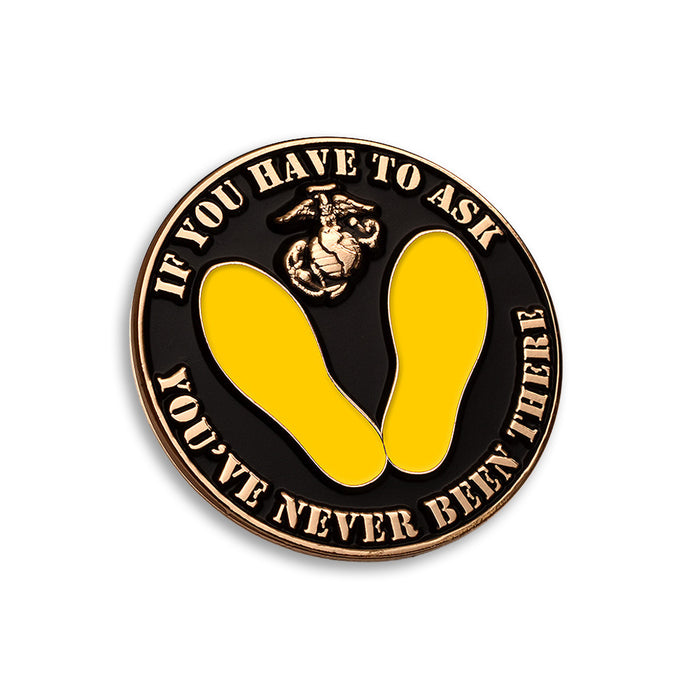The Yellow Footprint Once a Marine, Always a Marine Pin is a round Marine Corps pin featuring yellow footprints and the phrase “IF YOU HAVE TO ASK YOU’VE NEVER BEEN THERE,” with the Marine Corps emblem at the top—an iconic design inspired by the classic Parris Island experience.