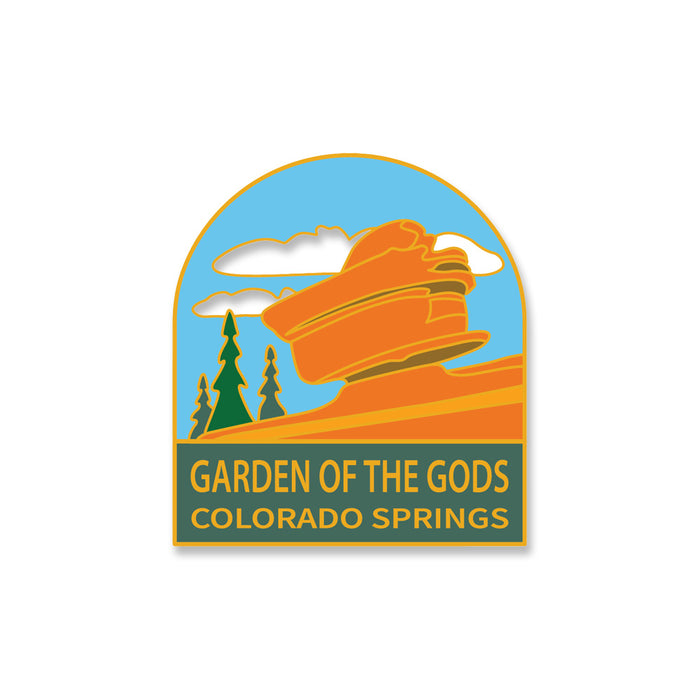 Here’s a rewritten sentence using your product data: Illustrated badge of the Garden of the Gods Balanced Rock Pin in Colorado Springs, Colorado, depicting vibrant orange rock formations, two trees, and clouds set against a blue sky. The design captures the charm of collectible playing cards with the text “Garden of the Gods Balanced Rock Pin, Colorado Springs.”.