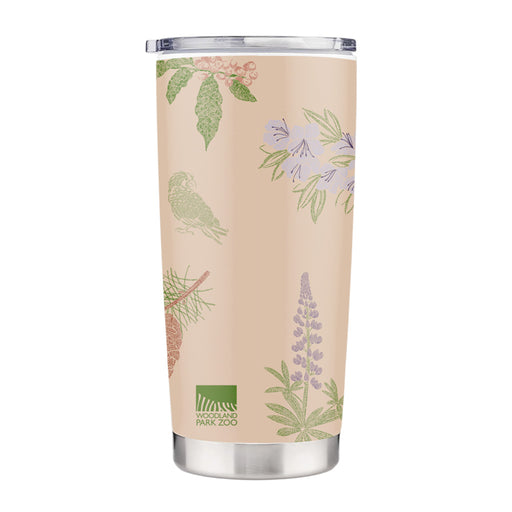 The Woodland Park Zoo Forest Trailhead Travel Mug is a beige stainless steel mug with pastel botanical illustrations of flowers, leaves, and a bird. The logo near the base highlights its stylish, eco-friendly design inspired by forest conservation.