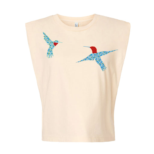The Desert Botanical Garden Will Beger Hummingbird Women's T-Shirt is a sleeveless cream top adorned with two mosaic-style blue and red hummingbirds on the upper left chest, inspired by the beauty of the Desert Botanical Garden.