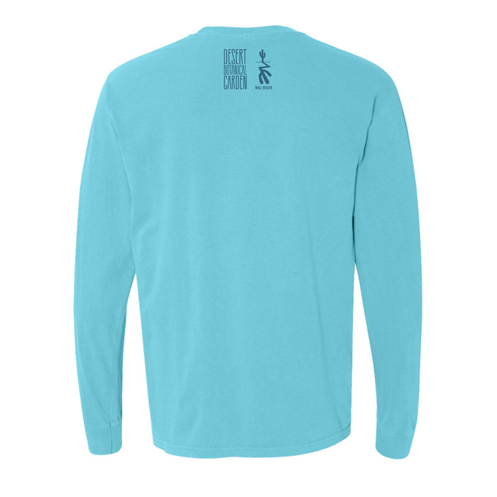 A light blue long-sleeve Desert Botanical Garden Will Beger Cactus T-Shirt seen from the back, featuring small black text and a stick-figure design near the neck that reads Desert Botanical Garden Wild Rising.