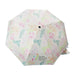 The Naples Botanical Garden Logo Umbrella features a vibrant floral pattern with green leaves and colorful flowers, and has the Naples Botanical Garden logo and text printed on one of its panels.