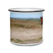 The Sergeant Reckless Camper Mug is a white enamel mug featuring a painted landscape of grassy fields with a horse’s head peeking in from the right side. A black rim lends a classic touch, while the soft, muted background evokes peaceful outdoor moments. This unique mug makes a thoughtful gift for anyone interested in military history or enjoying their favorite drink around the campfire.
