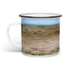 Introducing the Sergeant Reckless Camper Mug: a white enamel mug with a classic black rim, adorned with a vibrant landscape illustration depicting grassy brown and green fields beneath a blue sky. The scenic artwork wraps fully around the exterior, making this camper mug a perfect choice for military history enthusiasts and adventure lovers alike.