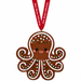 The Mote Marine Laboratory Gingerbread Octopus Ornament features a smiling octopus adorned with colorful sprinkles and hangs from a red ribbon inscribed with “Make Magic Laboratory,” offering a delightful tribute to marine conservation and the mission of Mote Marine Laboratory.