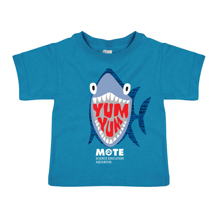 Introducing the Mote Marine Laboratory Yum Yum Shark Toddler T-Shirt: a blue t-shirt for toddlers featuring a lively cartoon shark with sharp teeth and “YUM YUM” boldly printed in red inside its mouth. Below the design, white text reads “MOTE Science Education Aquarium,” celebrating Mote Marine Laboratory and inspiring ocean conservation in young children.