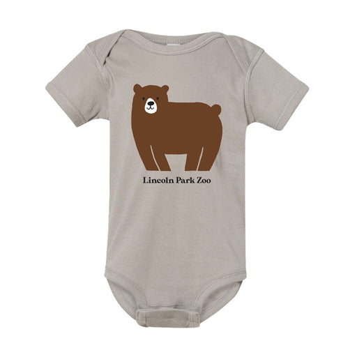 Outfit your baby in the Lincoln Park Zoo Brown Bear Infant Onesie—a beige onesie for infants, adorned with a charming cartoon brown bear above the words “Lincoln Park Zoo” on the front.