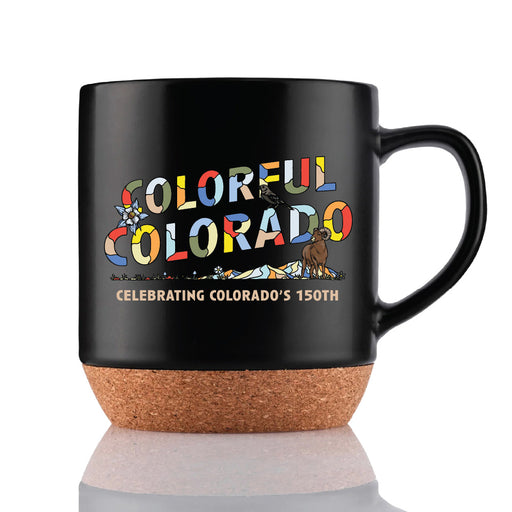 The Garden of the Gods Colorful Colorado 150th Mug features a black design with a cork base, vibrant “Colorful Colorado” lettering, and “Celebrating Colorado’s 150th” below. Mountain scenery, native flowers, and a bear illustration surround the text, making this the ideal collectible mug for anyone who appreciates the beauty of Garden of the Gods.