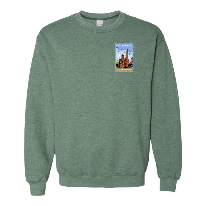 Celebrate your Colorado anniversary memories with the Garden of the Gods Colorado 150th Anniversary Sweatshirt—a green crewneck featuring a small, colorful graphic on the left chest that showcases Garden of the Gods’ iconic red rock formations like Cathedral Rock, a vivid blue sky, and “Colorado” written at the top.
