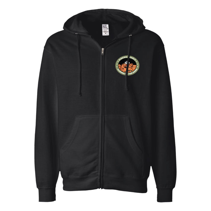 Garden of the Gods Kissing Camels Hooded Zip Sweatshirt: This black zip-up hoodie features front pockets and a drawstring hood. Inspired by Colorado Springs, it showcases a circular embroidered patch on the left chest with an orange pumpkin surrounded by green, orange, and white design elements—echoing the vibrant scenery near Garden of the Gods.
