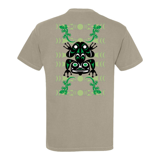 Woodland Park Zoo Jason LaClair Frog T-Shirt in beige, showcasing a bold black and green tribal frog design inspired by Coast Salish art on the back, accented with symmetrical green decorative patterns.