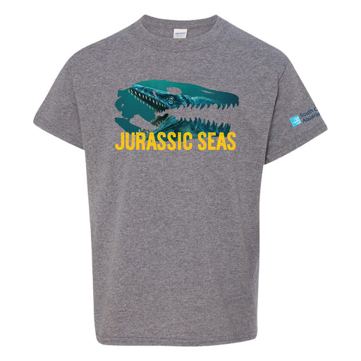 Gray T-shirt featuring a large teal marine reptile skull graphic above bold yellow text that reads JURASSIC SEAS; a logo is visible on the left sleeve.
