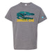 Gray T-shirt featuring a large teal marine reptile skull graphic above bold yellow text that reads JURASSIC SEAS; a logo is visible on the left sleeve.