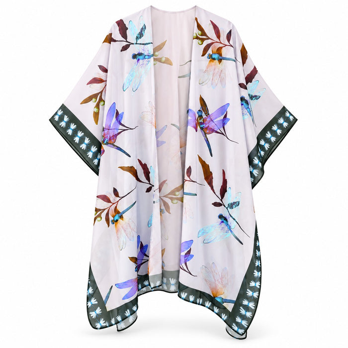 The Dragonfly Kimono is a lightweight, flowy piece adorned with a floral and dragonfly pattern in shades of blue, purple, and brown. A striking black border accented by a white leaf design frames the garment. Delicate dragonfly motifs woven throughout the kimono celebrate transformation and grace, adding symbolic meaning to its elegant style.