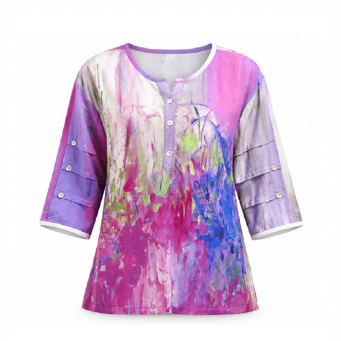 The Purple 3/4 Sleeve Women’s Top is a vibrant blouse featuring a watercolor-style pattern in shades of pink, purple, green, and blue. This stylish top has 3/4 sleeves with button details and a partial button-down front.