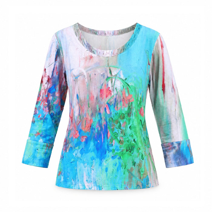 The Turquoise 3/4 Sleeve Women’s Top features a vibrant, abstract floral print in blue, green, pink, and red hues. Designed with a round neckline and cuffed 3/4 sleeves, this comfortable top offers versatile styling for any occasion.