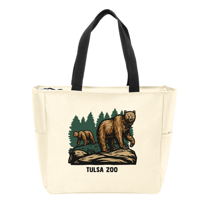 The Tulsa Zoo Brown Bear Tote is a cream tote with black handles, depicting two brown bears among green trees and “TULSA ZOO” beneath the image—ideal for wildlife conservation enthusiasts.