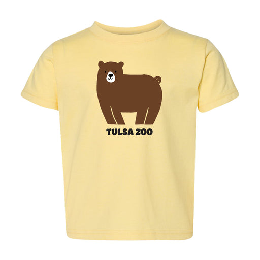 The Tulsa Zoo Bear Toddler T-Shirt is a light yellow tee with a cute cartoon brown bear above the words "Tulsa Zoo" in bold black letters.