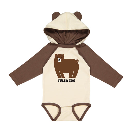 The Tulsa Zoo Bear Hooded Onesie is a beige and brown infant onesie with a hood featuring bear ears, a cute cartoon bear on the front, and “Tulsa Zoo” text—ideal for keeping your little one cozy and playful.