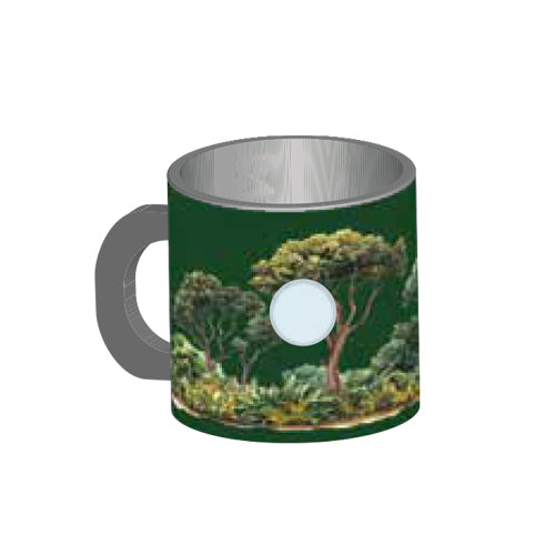 The Tulsa Zoo Giraffe Mini Mug Magnet is a green mug with a handle, decorated with trees and greenery inspired by wildlife conservation, and features a white circular spot on its side.